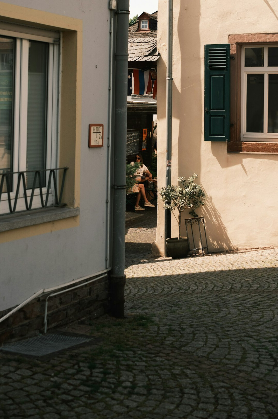 writer looking at old city street