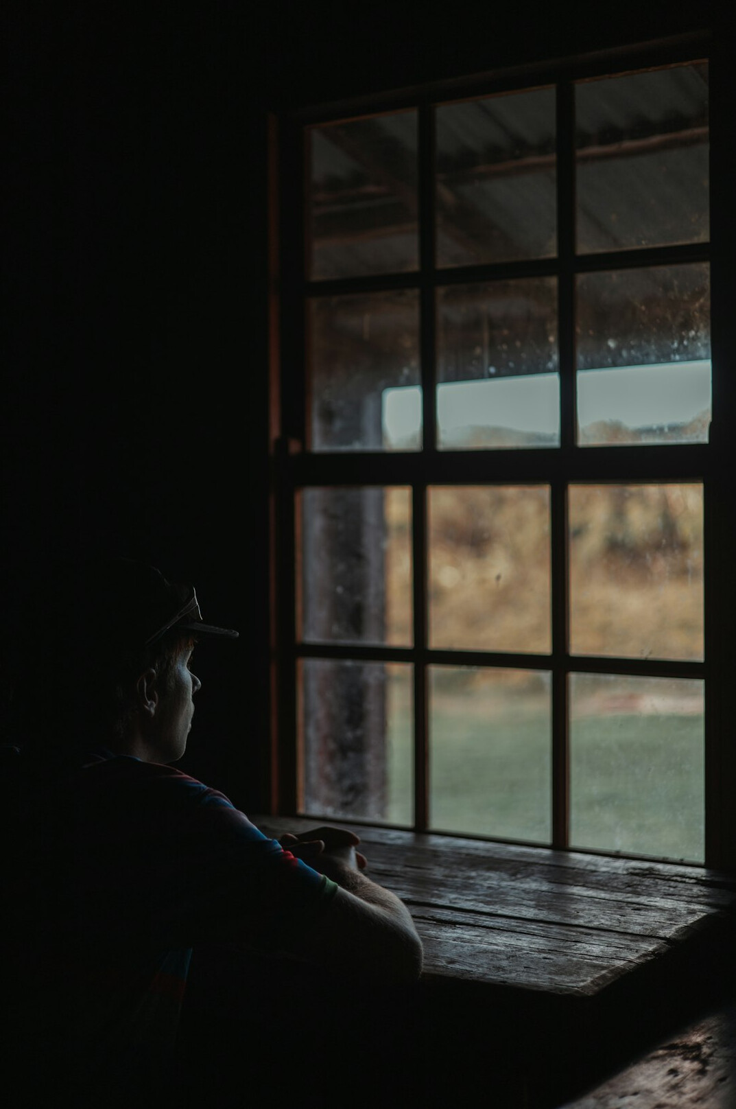 mystery writer looking out window