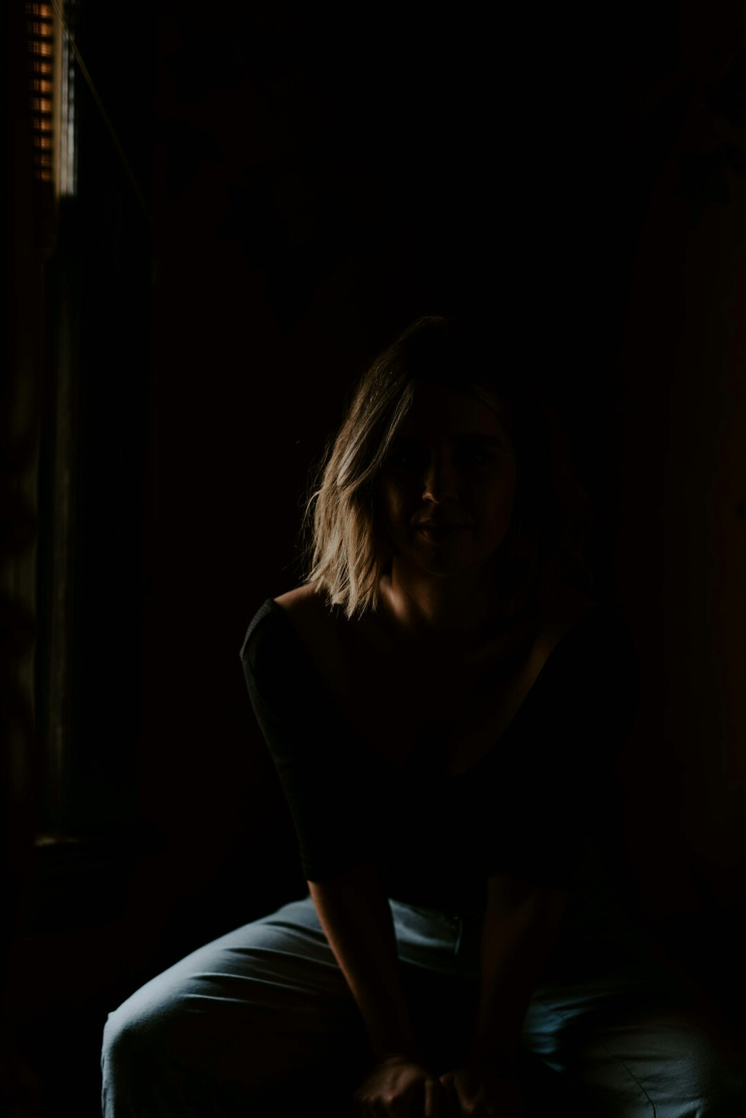 shadowy figure in dark room
